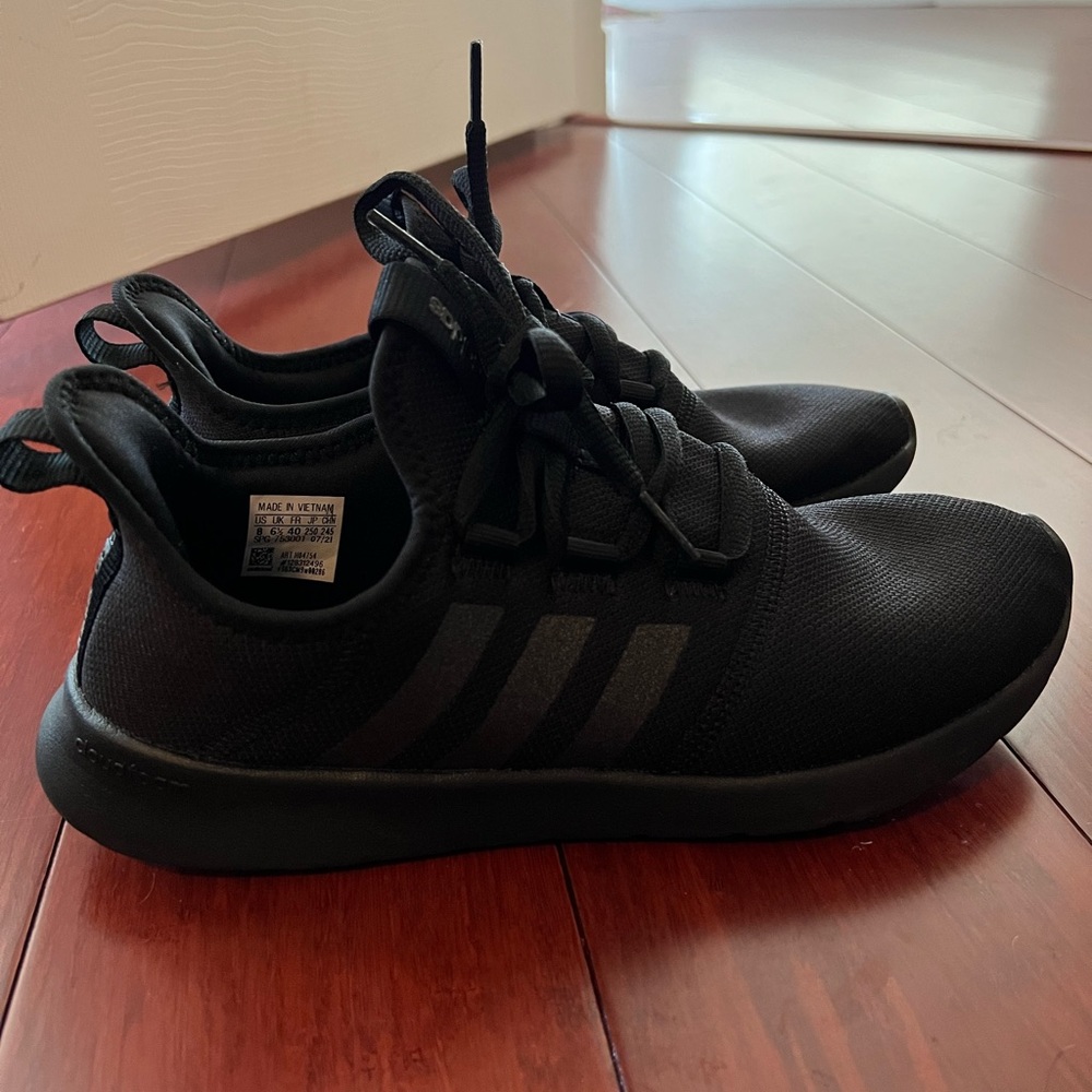 Adidas Cloudfoam PRIMEGREEN sneakers made from recycled materials.